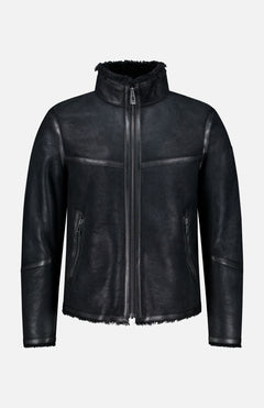 Channeling classic British heritage, the BELSTAFF Highland Shearling Jacket features a high collar and zipper closure, complemented by two zippered side pockets and a soft, textured finish. With its slightly rugged, matte appearance, visible stitching, and fleece-lined interior reminiscent of an English shearling jacket, it’s the perfect blend of timeless style and modern comfort.