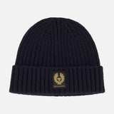 A black ribbed knit wool Watch Beanie Hat by BELSTAFF, featuring a folded brim and a square black and gold Belstaff logo patch on the front.