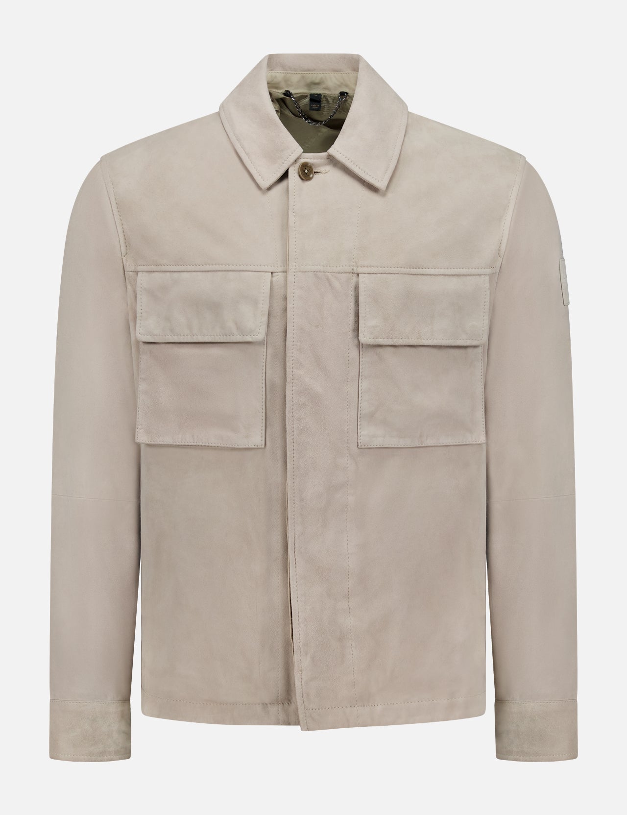 The BELSTAFF Waymark Suede Overshirt, shown on a plain white background, features a collared neckline, long sleeves, two large front flap pockets, and a hidden front zipper. Crafted from luxurious beige goat suede for lightweight layering.