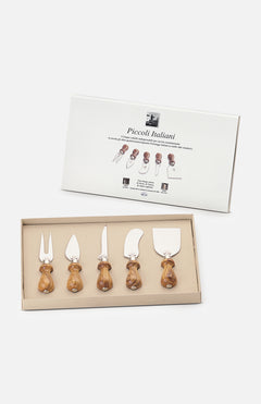 A boxed set of five Little Italians Cutting Cheese Knives by Berti Cutlery, each with olive wood handles, is displayed before its packaging. The box shows images and names of each handmade Italian knife and fork included.