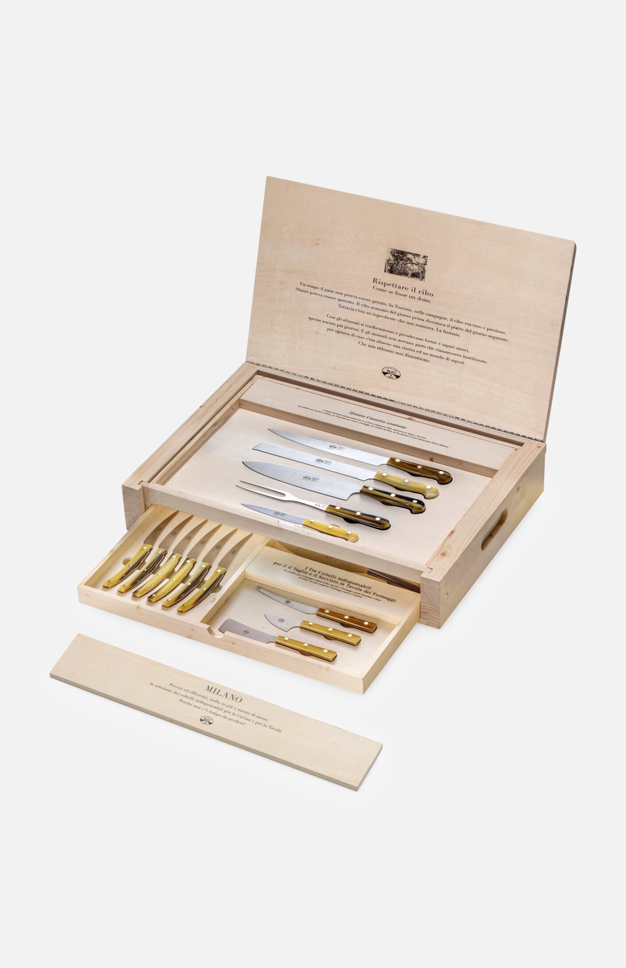 An open Milano Knives Box Set (Set of 15) by Berti Cutlery displays handmade knives with gold handles in a wooden presentation box, with printed logos on the lid and a tray for extra knives—a refined, luxury kitchen gift set.