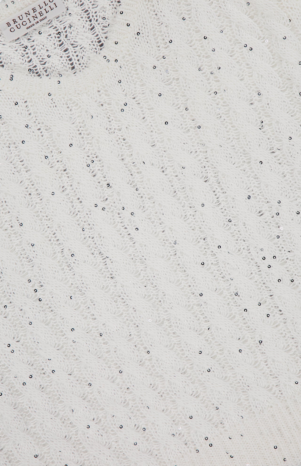 Close-up of a white knit Linen Charming Cable Scoop Neck Tank Top by BRUNELLO CUCINELLI, featuring small scattered silver beads and the brand's label, showcasing signature fitted design and craftsmanship.