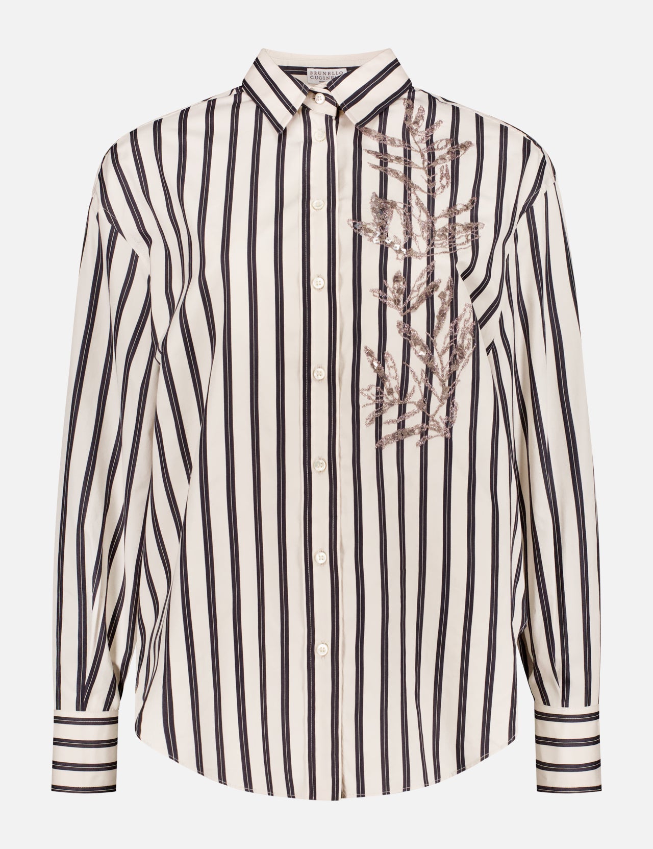 The BRUNELLO CUCINELLI Long Sleeve Button Up Embroidered Shirt features an oversized fit, vertical black and white stripes, and floral embroidery on the upper left chest, displayed against a plain white background.