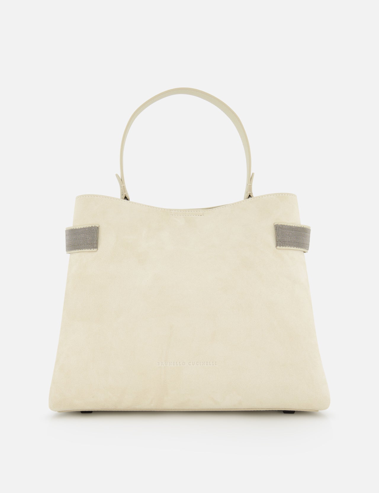 The BRUNELLO CUCINELLI Medium Soft Velour Essence Bag is a beige suede handbag with a structured shape, two short handles, and small gray strap accents, displayed against a white background.