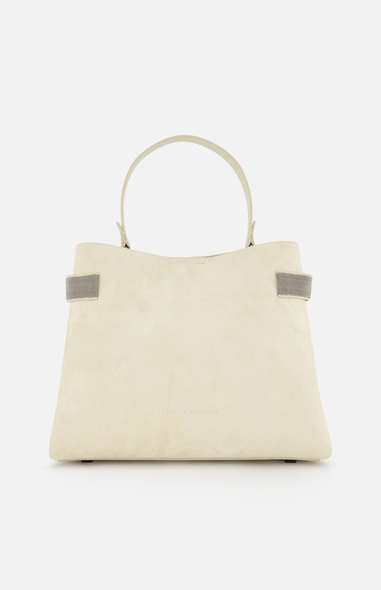 The BRUNELLO CUCINELLI Medium Soft Velour Essence Bag is a beige suede handbag with a structured shape, two short handles, and small gray strap accents, displayed against a white background.