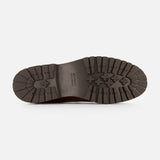 The image shows the bottom view of a dark brown sole with deep treads and a textured, rugged grip pattern, characteristic of the high-quality Leather and Suede Ankle Boots by BRUNELLO CUCINELLI, made in Italy.