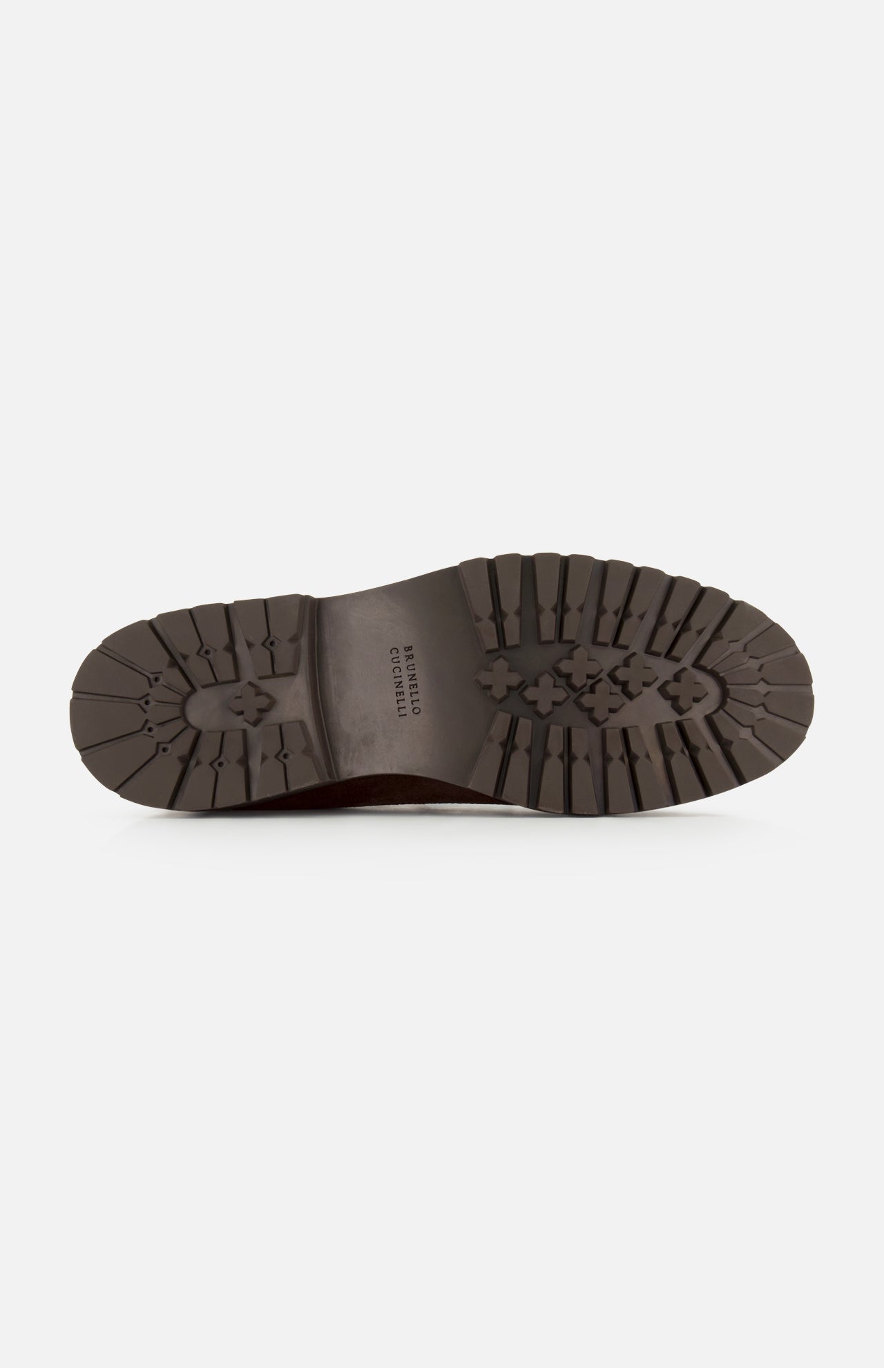 The image shows the bottom view of a dark brown sole with deep treads and a textured, rugged grip pattern, characteristic of the high-quality Leather and Suede Ankle Boots by BRUNELLO CUCINELLI, made in Italy.