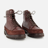 A pair of BRUNELLO CUCINELLI Leather and Suede Ankle Boots, featuring thick rubber soles and suede detailing, are positioned side by side on a white background. Expertly crafted in Italy, these boots combine style and durability for any adventure.