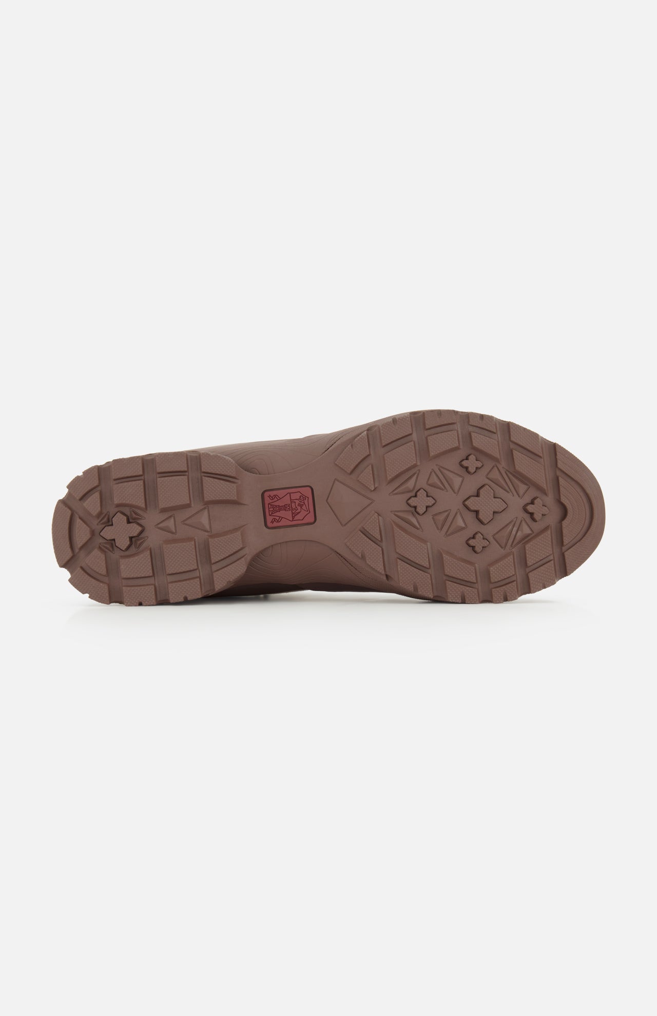 BRUNELLO CUCINELLI’s Ankle Hiker Boots feature a brown rubber sole with a rugged tread pattern composed of geometric shapes and textured grooves for dependable traction—perfect for outdoor adventures. A small red BRUNELLO CUCINELLI logo appears near the center, and the sole is shown against a white background.