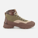 A side view of the BRUNELLO CUCINELLI Ankle Hiker Boots, showcasing brown, tan, and olive green suede and leather panels with a chunky brown sole, metal eyelets, and beige laces against a white background.