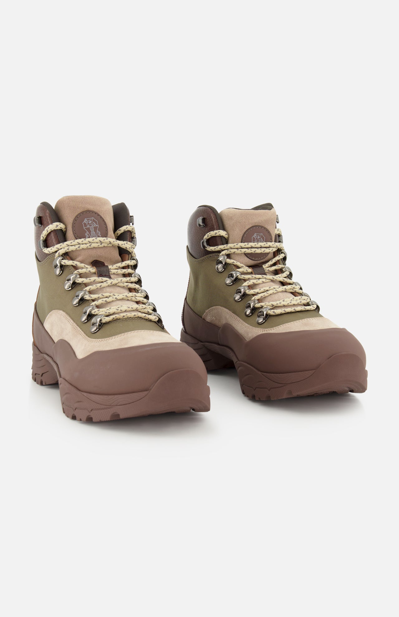 A pair of BRUNELLO CUCINELLI Ankle Hiker Boots in rugged brown and beige suede and leather, featuring thick soles and patterned laces, are positioned side by side on a white background.