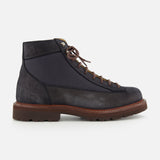 The BRUNELLO CUCINELLI Suede Ankle Boots feature a dark blue and black suede upper in a high-top, lace-up design with brown laces and a thick brown sole, displayed in a side view against a white background.