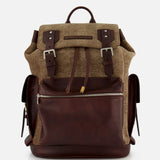 A BRUNELLO CUCINELLI Vintage Chevron-effect Backpack, featuring a brown leather and herringbone fabric design with front zipper pocket, buckle straps, leather inserts, adjustable shoulder straps, and side pockets, is displayed against a plain white background.