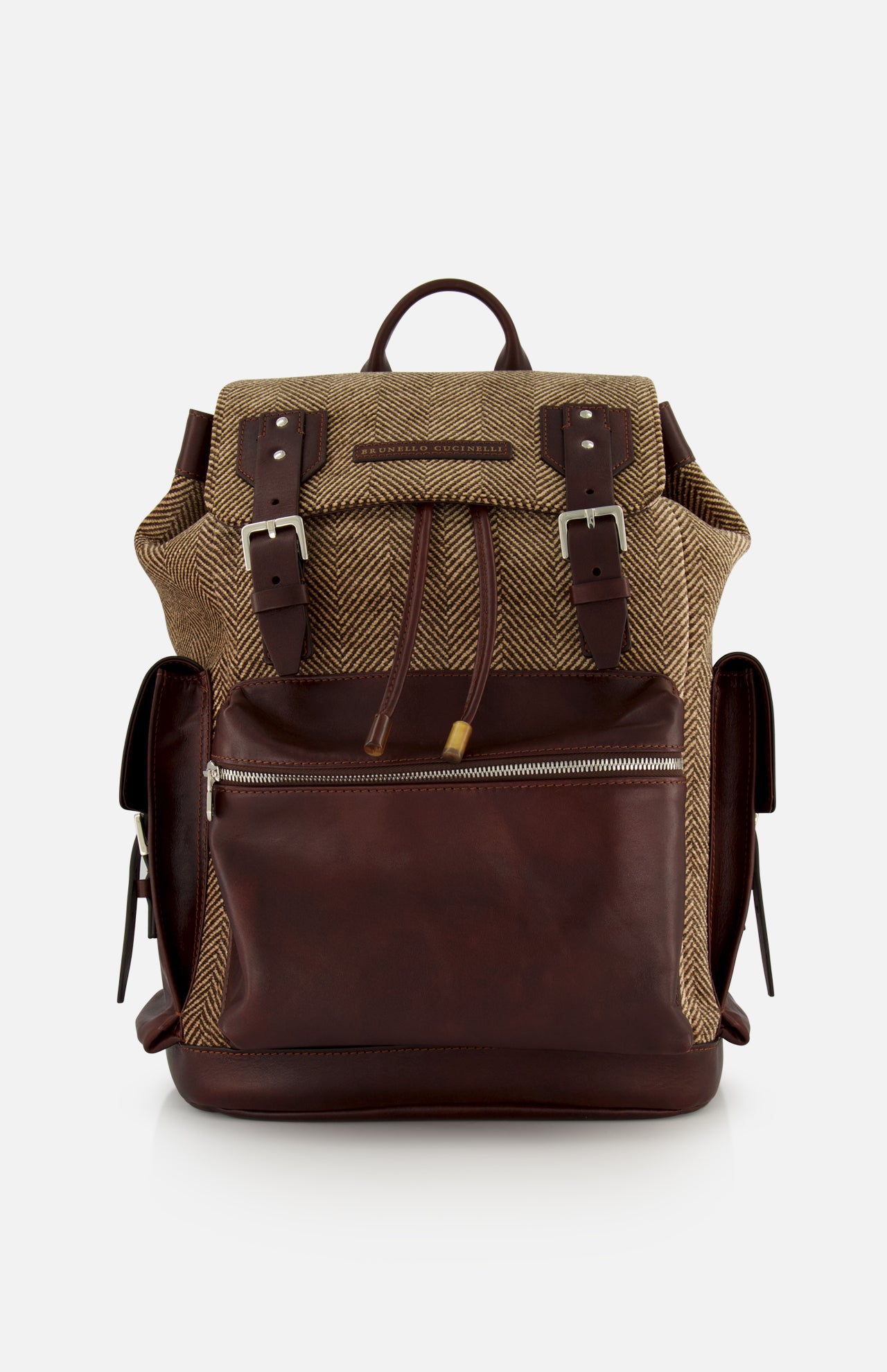 A BRUNELLO CUCINELLI Vintage Chevron-effect Backpack, featuring a brown leather and herringbone fabric design with front zipper pocket, buckle straps, leather inserts, adjustable shoulder straps, and side pockets, is displayed against a plain white background.