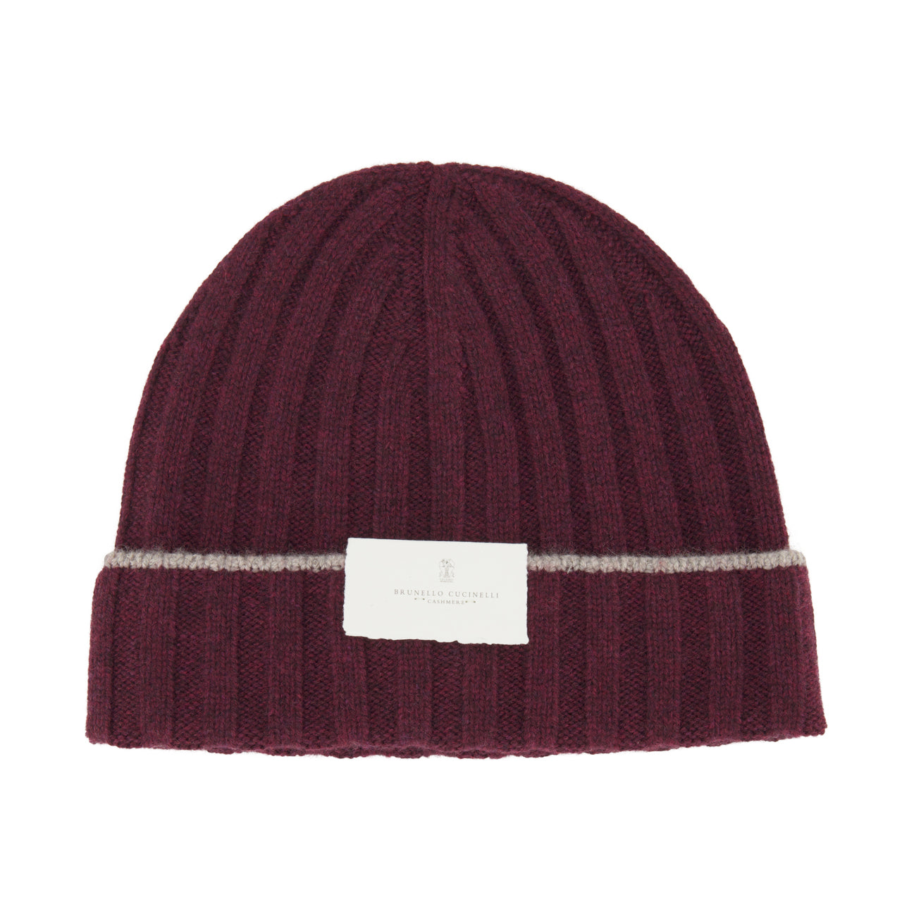 Introducing the Rib-knit Cashmere Beanie by BRUNELLO CUCINELLI: a stylish burgundy hat crafted in a classic rib-knit design for added texture and warmth, featuring a folded brim with a thin gray stripe above it and finished with a white rectangular label on the front.
