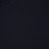 Close-up of the BRUNELLO CUCINELLI Cotton Crewneck T-Shirt in black, highlighting a portion of the collar and a white inner label with text, set against a plain background.