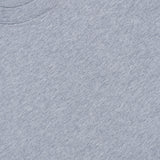 Here’s the rewritten sentence using the provided product data: A close-up of a heather gray BRUNELLO CUCINELLI Cotton Crewneck T-Shirt highlights the refined construction and slim fit, with part of the collar and a “Made in Italy” label visible in the top left corner.