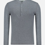 The BRUNELLO CUCINELLI Cotton Long Sleeve Henley T-shirt, shown in grey with ribbed detailing, features a short collar and a three-button front placket, presented against a plain white background.