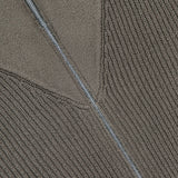 Close-up of the BRUNELLO CUCINELLI Cotton Zip Up Cardigan Sweater in dark grey, crafted from 100% cotton and designed with a partially unzipped silver zipper along a diagonal seam that highlights contrasting knit textures.