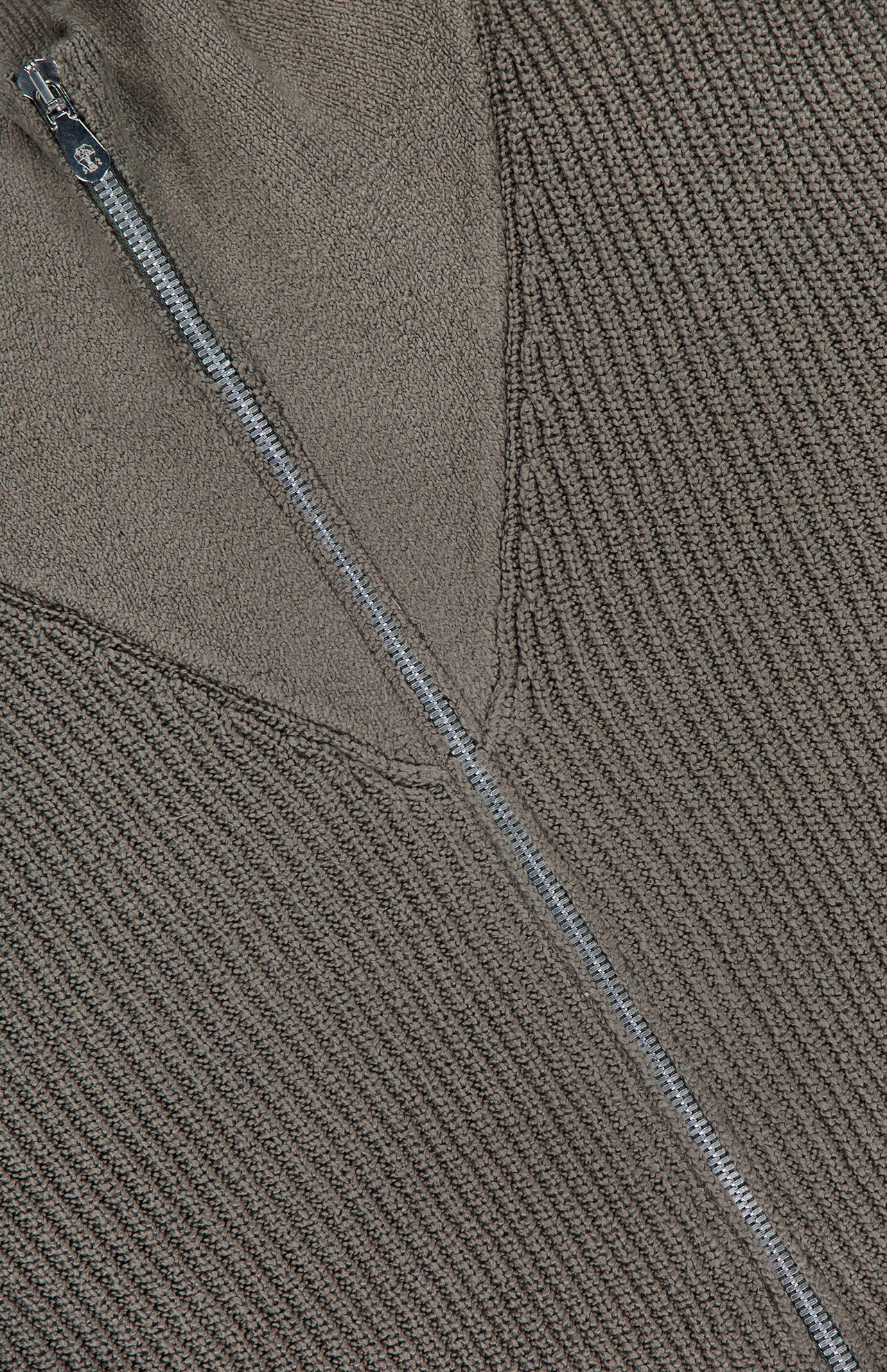 Close-up of the BRUNELLO CUCINELLI Cotton Zip Up Cardigan Sweater in dark grey, crafted from 100% cotton and designed with a partially unzipped silver zipper along a diagonal seam that highlights contrasting knit textures.