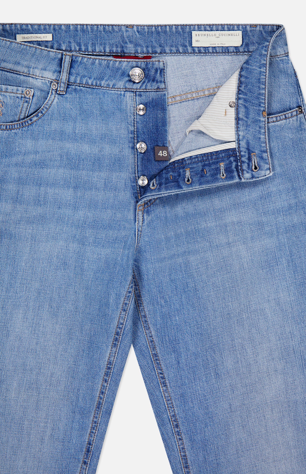 Introducing the Button Fly Denim Jeans by BRUNELLO CUCINELLI, crafted from premium Italian denim in a light blue wash. These jeans feature a partially open front with signature silver button fly closures, belt loops, and a white size 48 label inside the waistband. Finely finished with a subtle vintage treatment, this classic five-pocket design ensures timeless style and enduring quality.