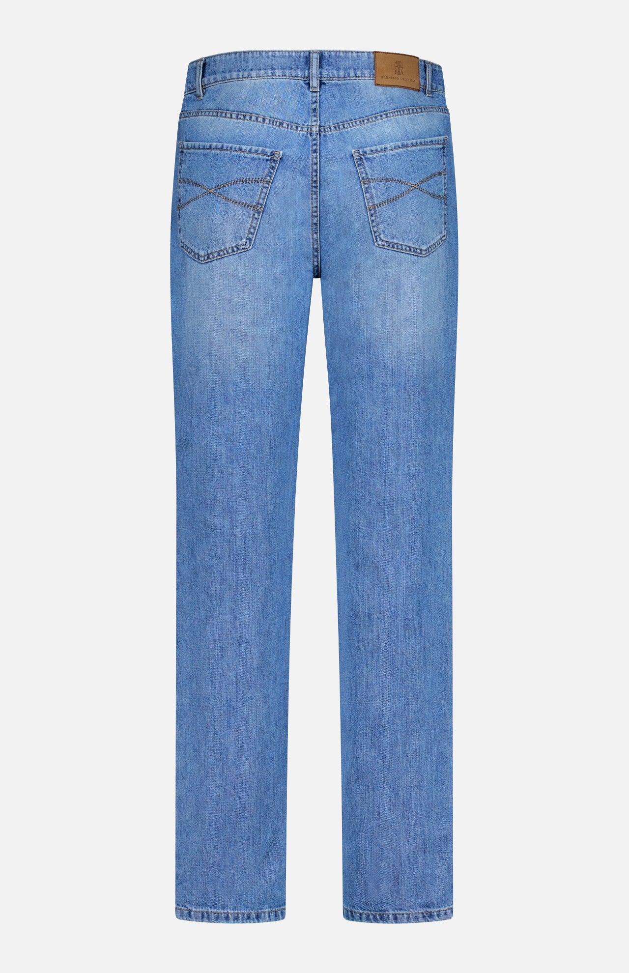 Back view of BRUNELLO CUCINELLI's Button Fly Denim Jeans in light blue, crafted from premium Italian denim, featuring two back pockets with crisscross stitching, a brown leather patch on the waistband, and straight-cut legs.