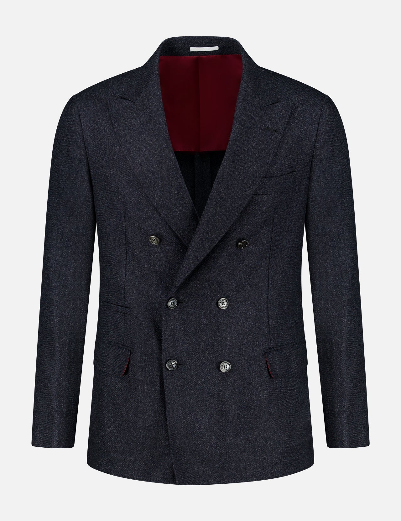 The BRUNELLO CUCINELLI Double Breasted Suit Jacket is shown on a plain white background. This dark navy jacket features six buttons, peaked lapels, and two front flap pockets. Expertly tailored from virgin wool, it has a luxurious deep burgundy interior lining.