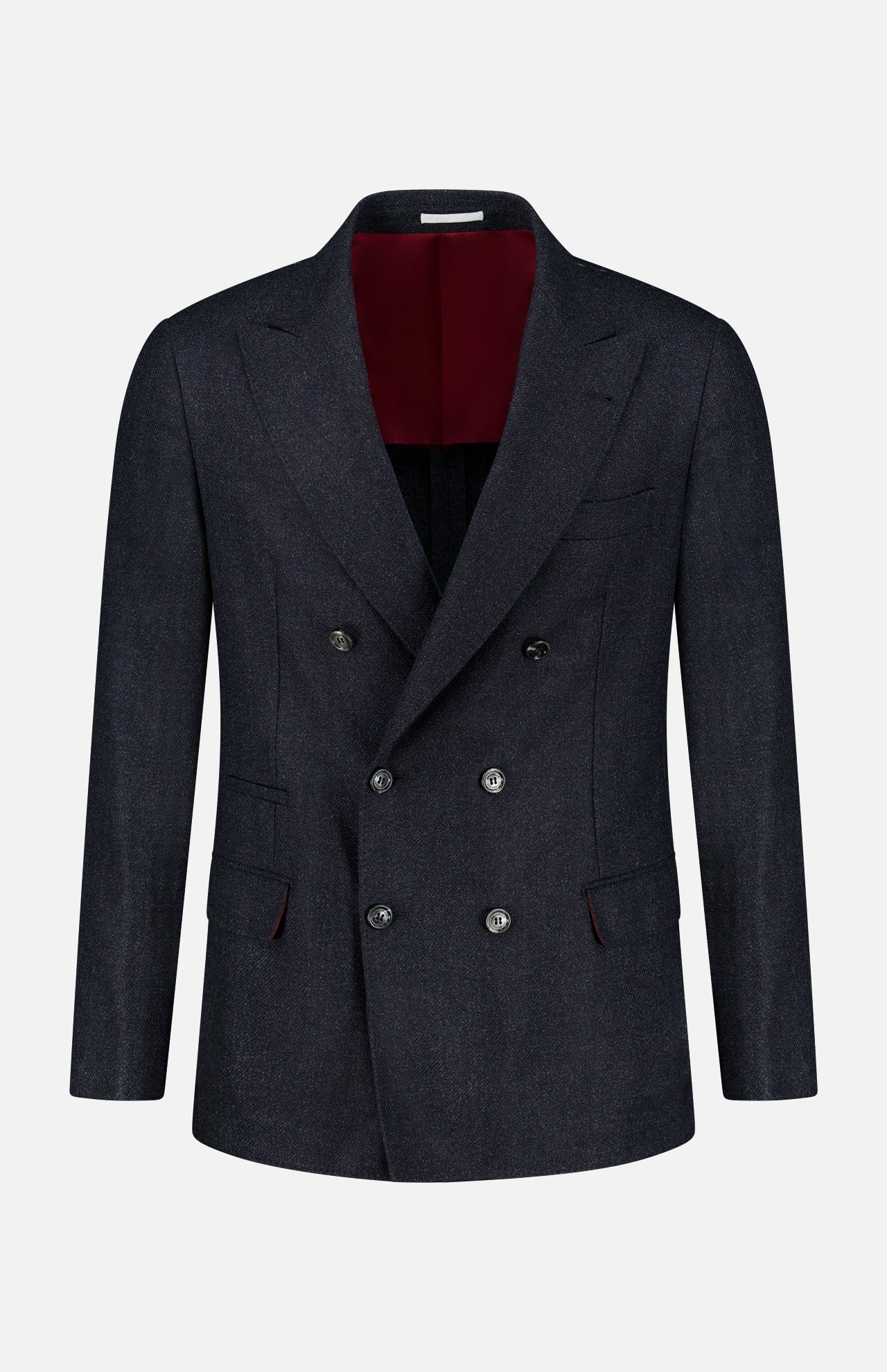 The BRUNELLO CUCINELLI Double Breasted Suit Jacket is shown on a plain white background. This dark navy jacket features six buttons, peaked lapels, and two front flap pockets. Expertly tailored from virgin wool, it has a luxurious deep burgundy interior lining.