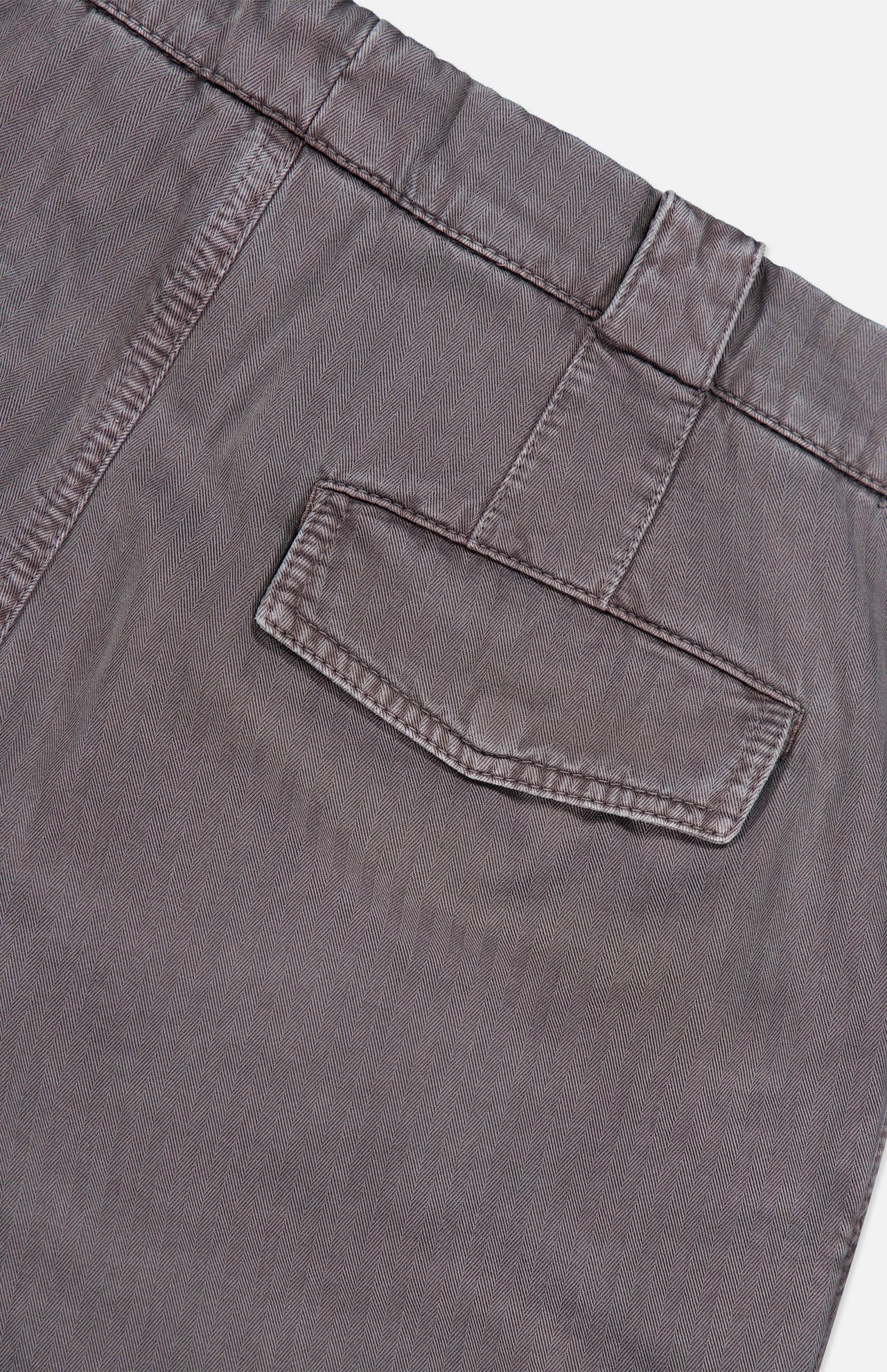 Close-up of a pair of BRUNELLO CUCINELLI Dyed Zigzag Cargo Trousers for men, featuring a brown cotton fabric with a waistband detailed with belt loops and a single back flap pocket, set against a white background.