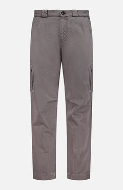 The Dyed Zigzag Cargo Trousers by BRUNELLO CUCINELLI feature a classic straight-leg silhouette with side pockets, a button and zip fly, and belt loops, reminiscent of traditional Italian cargo trousers. Shown here in gray against a plain white background.