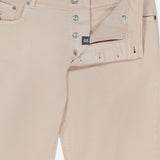 A close-up of BRUNELLO CUCINELLI’s Button Fly Dyed Denim Pants in beige, featuring the fly open to display metal buttons, a size 48 tag, and part of the waistband and pocket—expertly crafted from premium Italian denim.