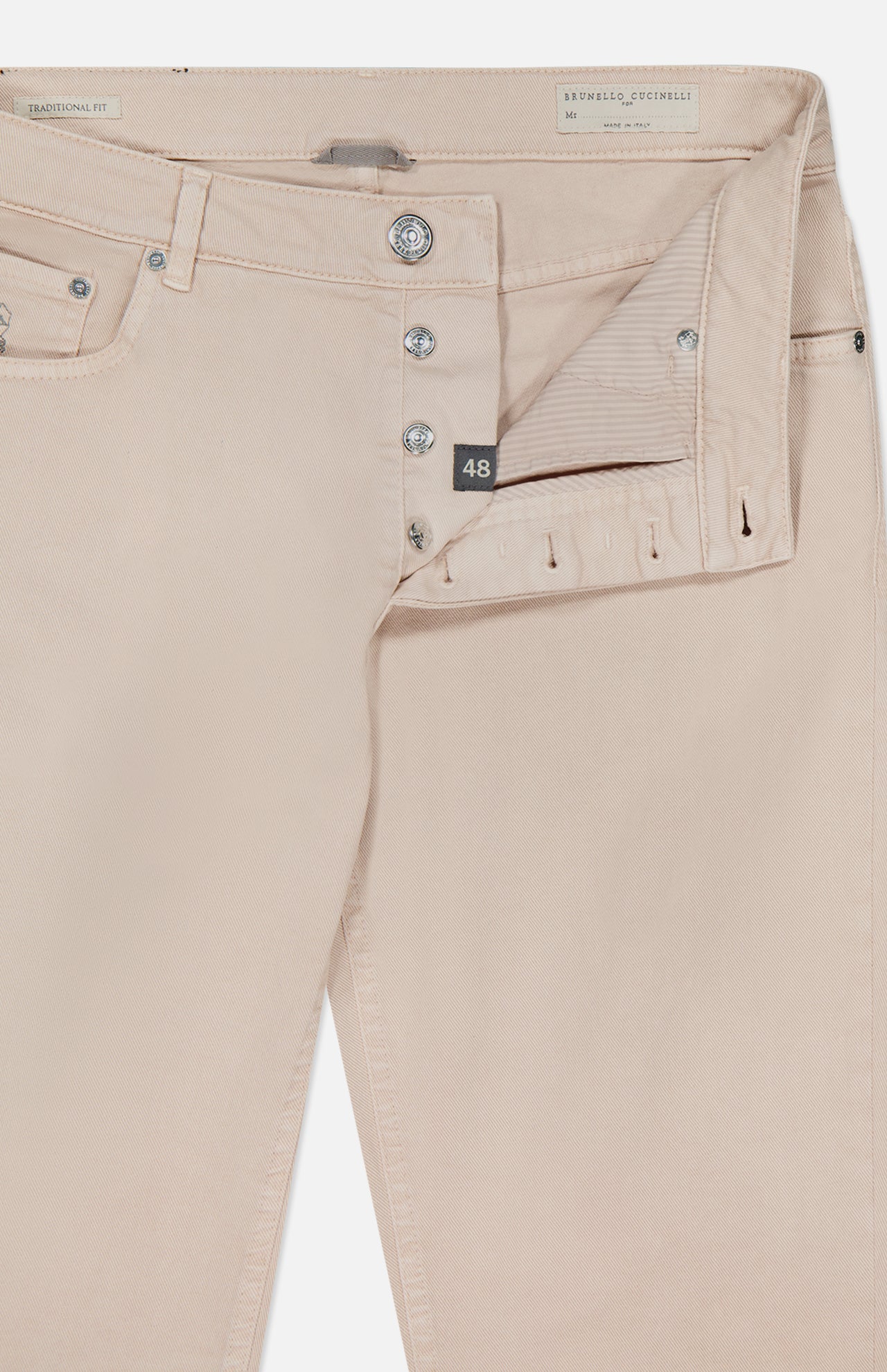 A close-up of BRUNELLO CUCINELLI’s Button Fly Dyed Denim Pants in beige, featuring the fly open to display metal buttons, a size 48 tag, and part of the waistband and pocket—expertly crafted from premium Italian denim.