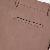 Close-up of the back of BRUNELLO CUCINELLI Garbardina Delave Trouser Pant in light brown, made in Italy, featuring a belt loop, waistband, and a single welt pocket without a visible button.