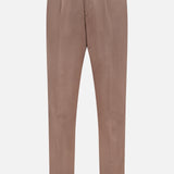 The Garbardina Delave Trouser Pant by BRUNELLO CUCINELLI is a light brown Italian-made silk linen-blend pant with button and zip closure, belt loops, front pleats, and turned-up hems, shown against a white background.