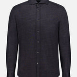 The BRUNELLO CUCINELLI Jersey Long Sleeve Dress Shirt features a black, collared, button-up design in a linen cotton blend, shown on a plain white background.