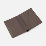 The BRUNELLO CUCINELLI Leather Passport and Cardholder is an open brown leather accessory featuring multiple card slots on the left side and two larger pockets on the right, displayed against a plain white background. This sophisticated piece can be used as both a wallet and passport holder, making it ideal for travel or everyday use.