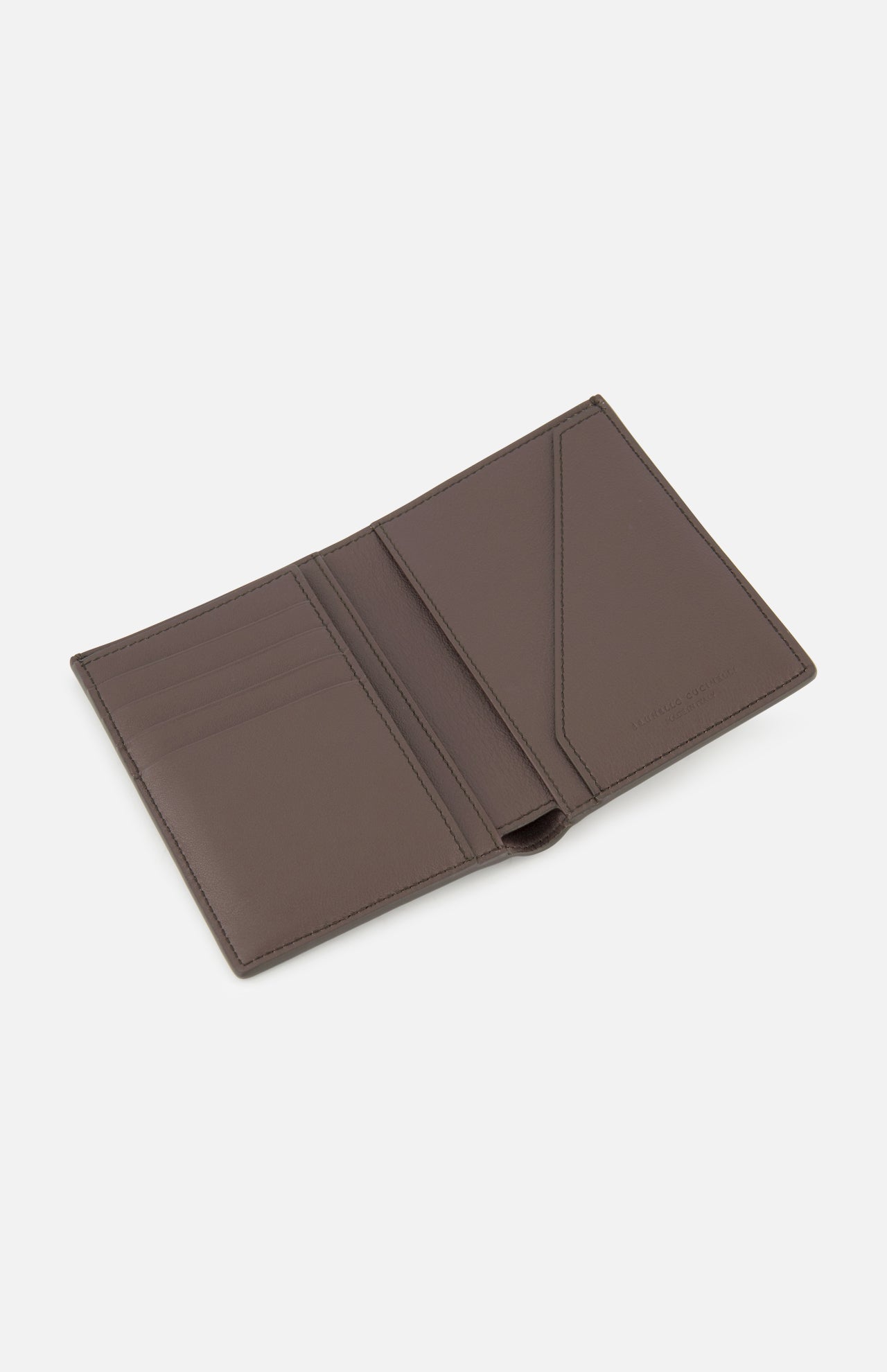 The BRUNELLO CUCINELLI Leather Passport and Cardholder is an open brown leather accessory featuring multiple card slots on the left side and two larger pockets on the right, displayed against a plain white background. This sophisticated piece can be used as both a wallet and passport holder, making it ideal for travel or everyday use.