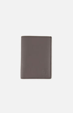 A closed, gray BRUNELLO CUCINELLI Leather Passport and Cardholder with a subtle embossed logo in the lower right corner, shown against a plain white background.