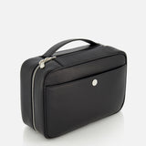 The BRUNELLO CUCINELLI Leather Dopp Kit is a rectangular black leather toiletry bag with a top handle, silver zippers, and a front pocket with a round metal button, displayed against a white background.