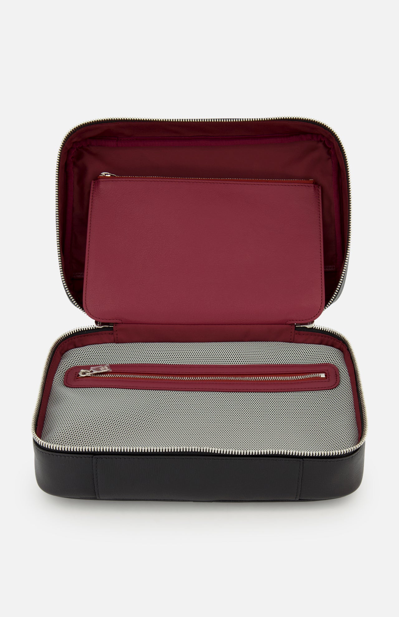 The BRUNELLO CUCINELLI Leather Dopp Kit is a black Italian-made toiletry bag with a burgundy interior, top zippered pocket, and bottom mesh zip compartment—combining style and function for travel.