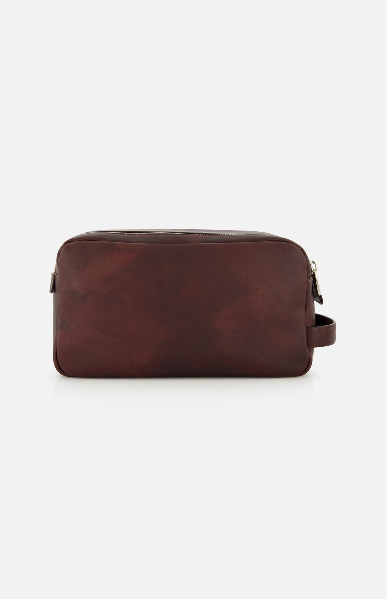 The BRUNELLO CUCINELLI Leather Dopp Kit is a rectangular, dark brown leather travel accessory—crafted in Italy—with a right-side handle and a top zipper, displayed against a plain white background; ideal for organizing your essentials in style.