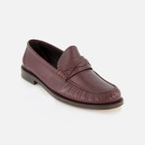 The BRUNELLO CUCINELLI Leather Woven Band Loafers are a menswear classic, crafted in Italy from burgundy leather with a woven band and moccasin-style stitching, shown on a white background for timeless style.
