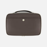 The BRUNELLO CUCINELLI Leather Travel Bag is a brown leather briefcase with a top handle and a front pocket, distinguished by a small circular silver emblem at its center. Exuding sophistication and practicality, this men's travel accessory is ideal for those who value the refined style associated with luxury travel beauty cases.