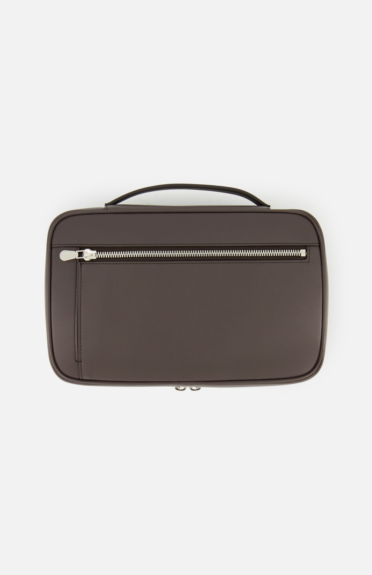 A brown rectangular Leather Travel Bag by BRUNELLO CUCINELLI, featuring a top handle and a front zippered pocket, is photographed against a white background. This luxury toiletry case is an indispensable men's travel accessory, expertly blending style and functionality for all your journeys.