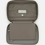 Open leather travel bag by BRUNELLO CUCINELLI in gray, featuring a zip closure, inner flap, fabric lining, snap button, and a visible label on the interior pocket—crafted as an elegant men's accessory inspired by the classic toiletry bag.