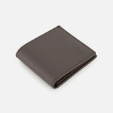 A closed, dark brown Smooth Leather Wallet from BRUNELLO CUCINELLI, featuring a refined embossed logo, is showcased at an angle on a plain white background—embodying luxury organization and timeless sophistication. Expertly crafted in Italy, this premium accessory demonstrates impeccable quality.