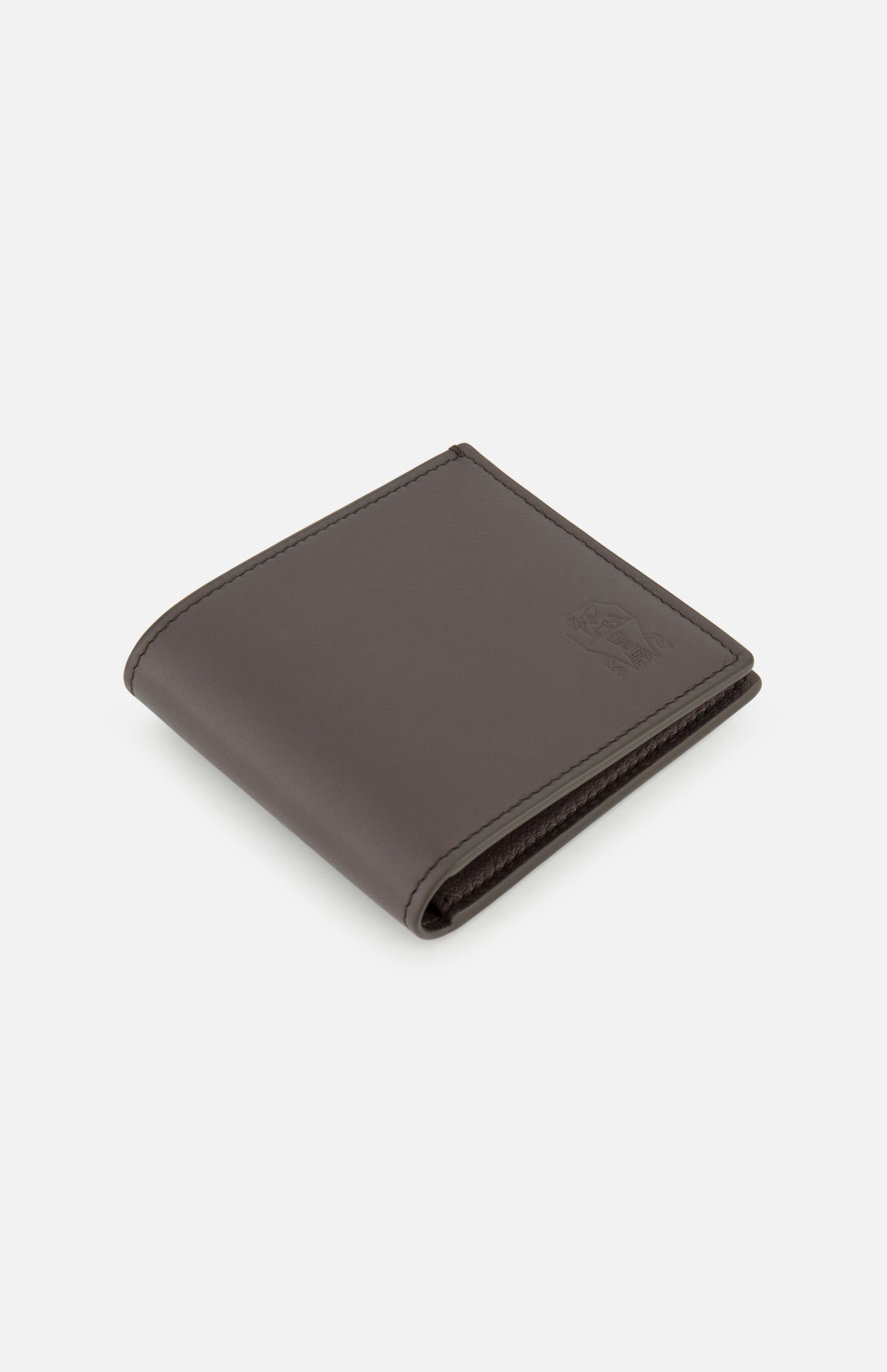 A closed, dark brown Smooth Leather Wallet from BRUNELLO CUCINELLI, featuring a refined embossed logo, is showcased at an angle on a plain white background—embodying luxury organization and timeless sophistication. Expertly crafted in Italy, this premium accessory demonstrates impeccable quality.
