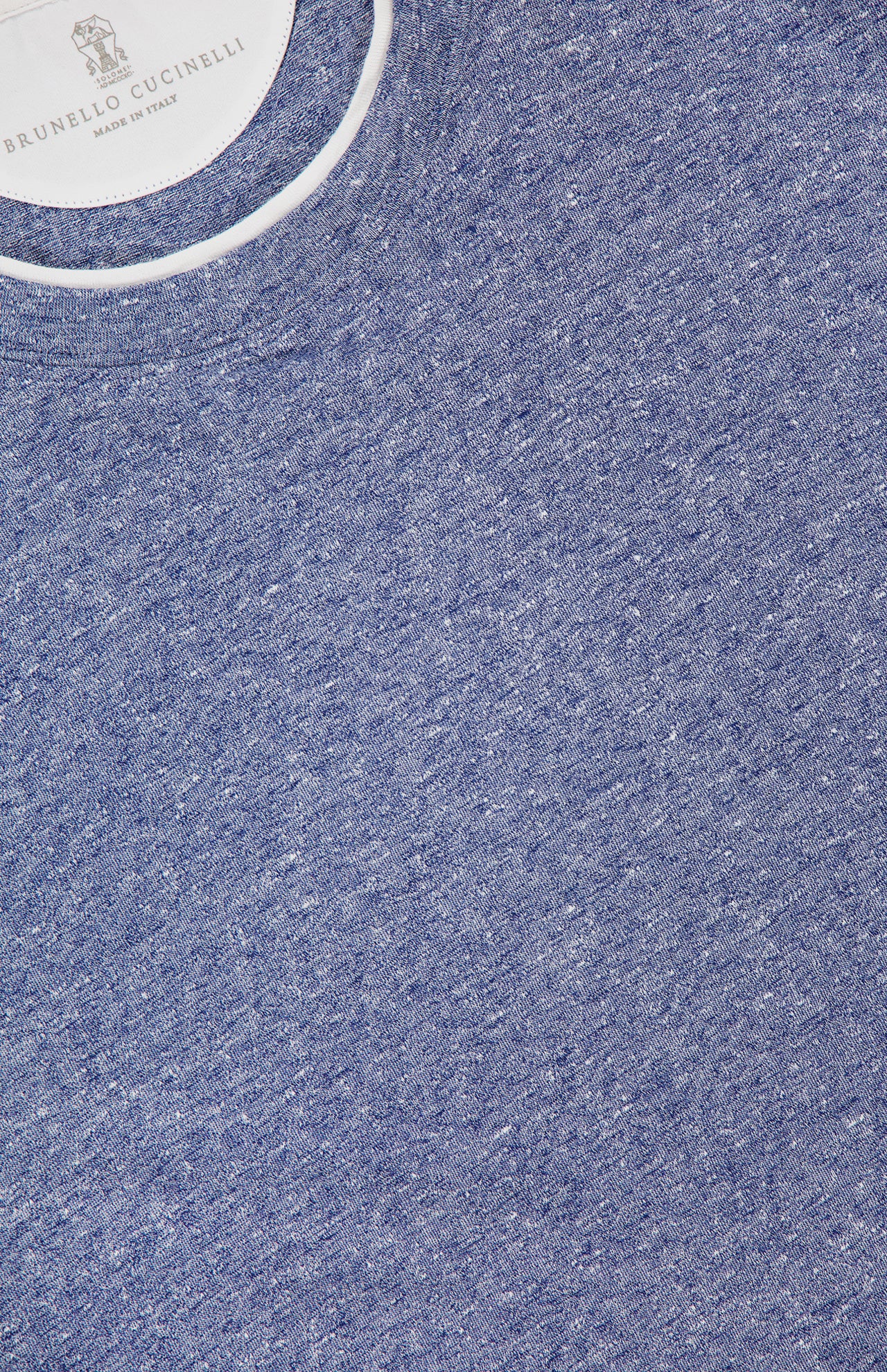 Close-up of BRUNELLO CUCINELLI Linen Cotton Double Layered T-Shirt in blue, featuring a crew neck with white collar trim and an inside label reading "BRUNELLO CUCINELLI Made in Italy" beneath a crest.
