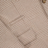 Close-up of the BRUNELLO CUCINELLI Plaid Wool-blend Sportcoat, showcasing a button, fine stitching details, and two front pockets on textured luxury fabric.