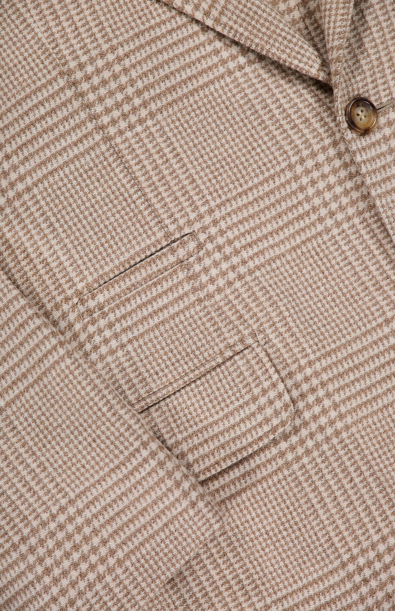 Close-up of the BRUNELLO CUCINELLI Plaid Wool-blend Sportcoat, showcasing a button, fine stitching details, and two front pockets on textured luxury fabric.